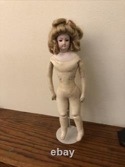 17 Francois Gaultier (F. G.) Bisque Doll With Leather Body (tear in left elbow)