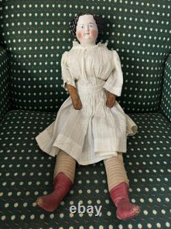 19th Century 21 China Head Doll withLeather Arms & Boots, Flat Top Black Hair