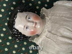 19th Century 21 China Head Doll withLeather Arms & Boots, Flat Top Black Hair