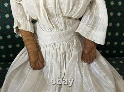 19th Century 21 China Head Doll withLeather Arms & Boots, Flat Top Black Hair