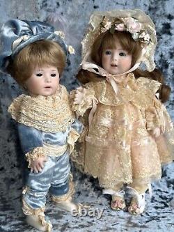 2 Rare Vintage Reproduction of Swaine & Co Porcelain Blue Boy & Pink Girl Dolls