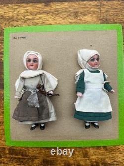 2 antique porcelain dolls on card Hertwig & co