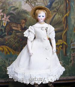 4 (36 cm) ANTIQUE FRENCH BISQUE POUPEE WITH SUPERB PIQUE DRESS AND BISQUE ARMS