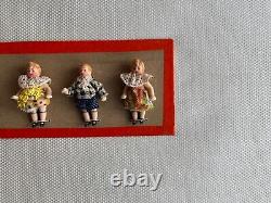 6 clothed antique porcelain dolls on sample card Hertwig & Co