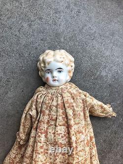 An Antique Porcelain Head Doll