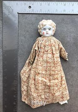 An Antique Porcelain Head Doll