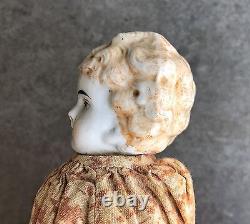 An Antique Porcelain Head Doll