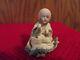 Antique 2 1/2 Inch Porcelain Sitting Baby Doll With Vintage Clothes