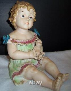 Antique German Bisque Porcelain Piano Baby Girl & Holding a Doll huge