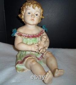 Antique German Bisque Porcelain Piano Baby Girl & Holding a Doll huge