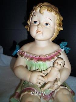 Antique German Bisque Porcelain Piano Baby Girl & Holding a Doll huge