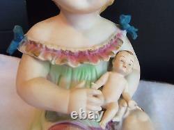 Antique German Bisque Porcelain Piano Baby Girl & Holding a Doll huge