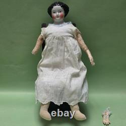 Antique German China head doll 15 inches tall and also included doll chair