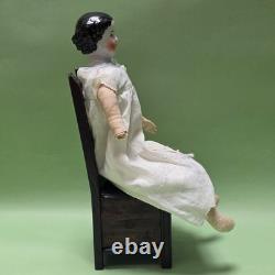 Antique German China head doll 15 inches tall and also included doll chair