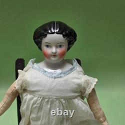 Antique German China head doll 15 inches tall and also included doll chair