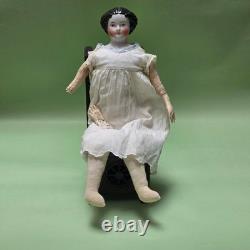 Antique German China head doll 15 inches tall and also included doll chair