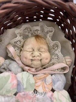 Antique Miniature Baby Doll In Woven Basket- Extremely Ugly Baby