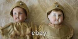 Antique Pair of Small German Bisque Head Dolls in Original Clothing