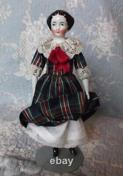 Beautiful china porcelain doll, hairstyle 1860, full dressed