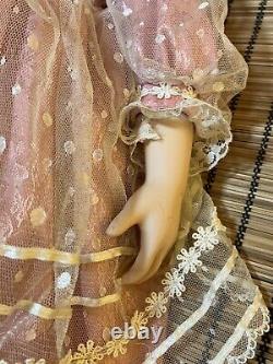 Charming Vintage Porcelain Doll with Blonde Curly Hair and Dress