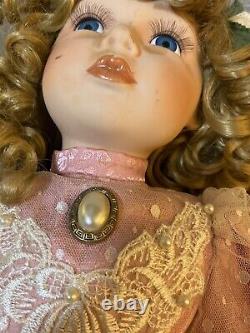 Charming Vintage Porcelain Doll with Blonde Curly Hair and Dress