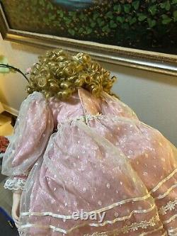 Charming Vintage Porcelain Doll with Blonde Curly Hair and Dress