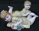Nice Antique Porcelain Piano Babies Boy & Girl With Doll