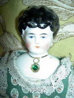 Pretty antique china head doll with imbeded Jeweled necklace by Hertwig, Germany