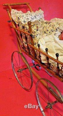 RARE Antique 1800's 4 metal Wheel Wood Doll Carriage Vtg Jointed Porcelain Doll
