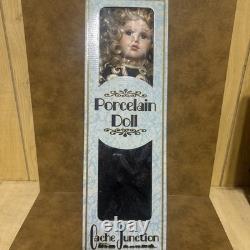 Unique Cache Junction Porcelain Doll Hand Crafted Blonde Hair Blue Eyes