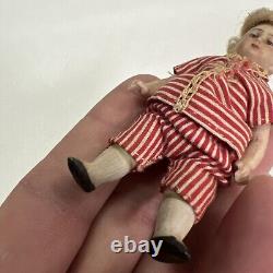 VINTAGE or ANTIQUE MINIATURE PORCELAIN BOY DOLL IN STRIPED CLOTHES DOLLHOUSE