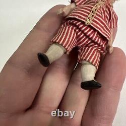 VINTAGE or ANTIQUE MINIATURE PORCELAIN BOY DOLL IN STRIPED CLOTHES DOLLHOUSE