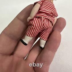 VINTAGE or ANTIQUE MINIATURE PORCELAIN BOY DOLL IN STRIPED CLOTHES DOLLHOUSE