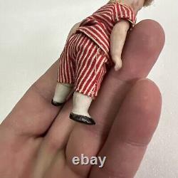 VINTAGE or ANTIQUE MINIATURE PORCELAIN BOY DOLL IN STRIPED CLOTHES DOLLHOUSE