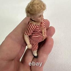 VINTAGE or ANTIQUE MINIATURE PORCELAIN BOY DOLL IN STRIPED CLOTHES DOLLHOUSE