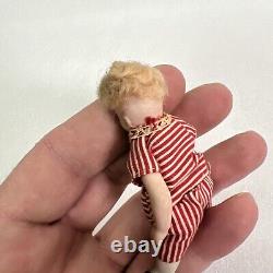 VINTAGE or ANTIQUE MINIATURE PORCELAIN BOY DOLL IN STRIPED CLOTHES DOLLHOUSE