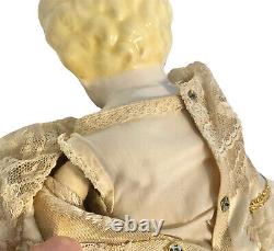 Vintage 19 porcelain doll in ornate dress with petticoats
