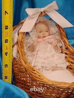 Vintage 1980 Phyllis Parkins Porcelain 4.5 Baby Doll in wicker bassinet frilly