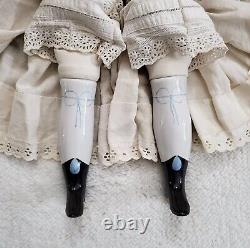 Vintage 22.5 Tall Porcelain Black Hair Cloth Body China Head Doll