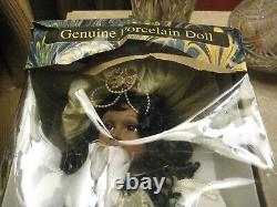 Vintage African American Porcelain Doll in Original Packaging. BRAND NEW