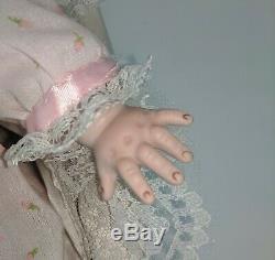 Vintage Bisque 1923 Grace S Putnam porcelain baby doll with bassinet
