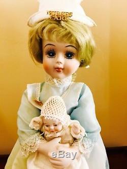 Vintage Bisque Red Cross Nurse Doll Holding Beautiful Bisque Baby Doll