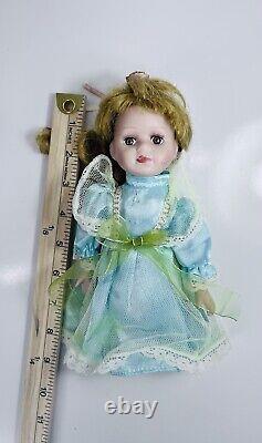 Vintage Porcelain Doll 8inch collection of 6 with Stand by The Far East Brokers
