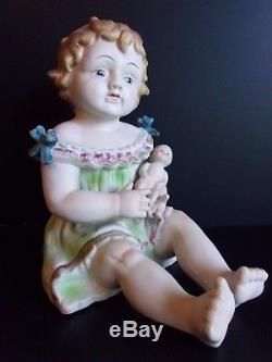 Vintage Porcelain Piano Baby Girl Holding Doll