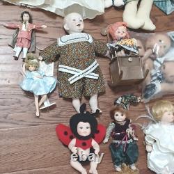 Vintage Porcelain and other dolls Lot of 23 plus some accessories and parts. PO