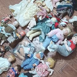 Vintage Porcelain and other dolls Lot of 23 plus some accessories and parts. PO