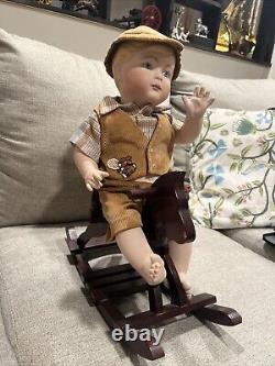 Vintage Porcelain doll Porcelain Boy On Wooden Rocking Horse Very rare