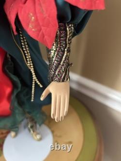 Vintage Show Stopper Mardi Grass Porcelain Xmas Doll -Poinsettia Design