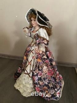 Vintage Victorian Porcelain Doll with curly hair