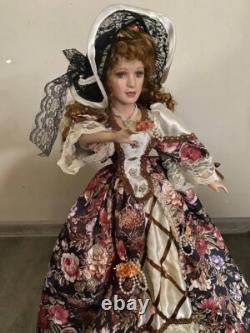 Vintage Victorian Porcelain Doll with curly hair